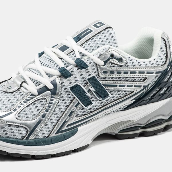 Gray athletic sneakers with mesh and accents
