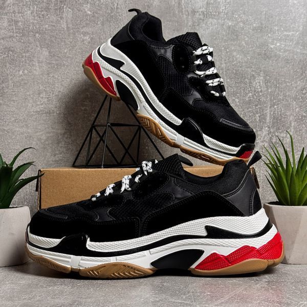 Black high-top sneakers in the Triple S style