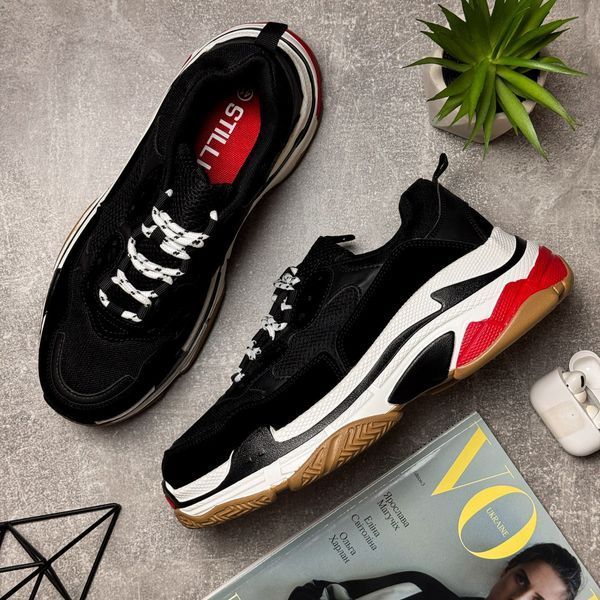 Black high-top sneakers in the Triple S style