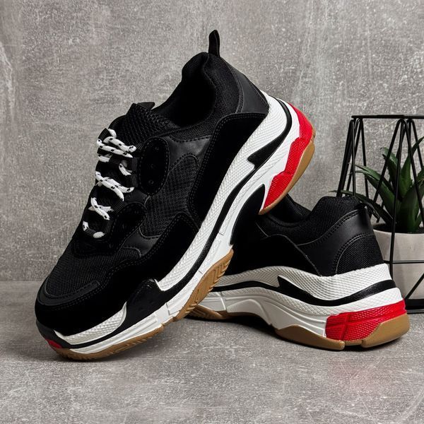 Black high-top sneakers in the Triple S style